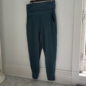 Lululemon jogger pants in teal green, size 10. Wide, fold-over waistband.